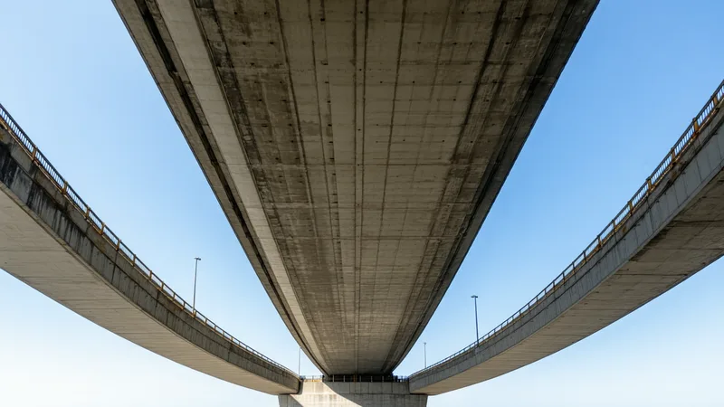 Highway bridge deck from below showing concrete soffit and structural details